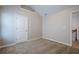 Carpeted bedroom featuring neutral walls, an interior door, and a small shelf at 920 Sublime Trl, Canton, GA 30114