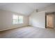 Carpeted bedroom with neutral walls, window, and interior door to a closet at 920 Sublime Trl, Canton, GA 30114