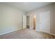 Bedroom featuring neutral carpet and trim, large closet, and light gray walls at 920 Sublime Trl, Canton, GA 30114