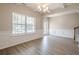 Dining area featuring a large window, wainscoting, and an elegant light fixture at 920 Sublime Trl, Canton, GA 30114