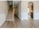 Light-filled foyer with hardwood flooring and an elegant staircase leading to the upper level at 920 Sublime Trl, Canton, GA 30114