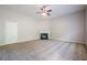Living room featuring fireplace, neutral carpet, and light gray walls at 920 Sublime Trl, Canton, GA 30114