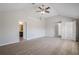 Large carpeted main bedroom with open bathroom and closet at 920 Sublime Trl, Canton, GA 30114
