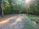 Gravel driveway leading to a tranquil wooded area at 340 Pat Rich, Canton, GA 30115
