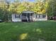 Charming home featuring a covered front porch and set on a spacious, well-manicured lawn at 340 Pat Rich, Canton, GA 30115