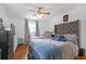 Comfortable bedroom with two beds, a ceiling fan, and ample natural light at 470 Oriole Dr, Marietta, GA 30067