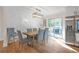 Bright dining room with a backyard view, modern lighting, and stainless steel appliances at 470 Oriole Dr, Marietta, GA 30067