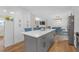 Open-concept kitchen with an island, stainless steel appliances, and a connecting dining area at 470 Oriole Dr, Marietta, GA 30067