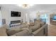 Open-concept living room with modern decor, fireplace and view to the dining area at 470 Oriole Dr, Marietta, GA 30067