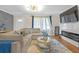 Cozy living room with a large sectional, stylish coffee table and electric fireplace at 470 Oriole Dr, Marietta, GA 30067