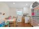 Well-organized office space with a large desk, built-in shelving, and natural light at 470 Oriole Dr, Marietta, GA 30067