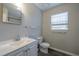 Cozy bathroom featuring modern sink and vanity, with a neutral color palette at 718 Dalvigney Nw St, Atlanta, GA 30318