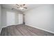 Light-filled bedroom featuring modern ceiling fan and hardwood floors at 718 Dalvigney Nw St, Atlanta, GA 30318