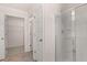 Bathroom with shower, linen closet and view into the walk in closet at 290 Halibut Cir, Covington, GA 30016