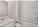 Clean bathroom featuring a shower-tub, vanity, toilet, and mirror at 290 Halibut Cir, Covington, GA 30016