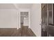 Open entryway showcasing hardwood floors and neutral walls leading to the main living areas at 290 Halibut Cir, Covington, GA 30016