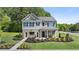 Beautiful two-story home featuring a brick and gray siding exterior and meticulously landscaped front yard at 290 Halibut Cir, Covington, GA 30016