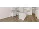 Modern kitchen featuring a central island with granite countertops and sleek cabinets at 290 Halibut Cir, Covington, GA 30016