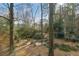 A lush backyard featuring mature trees and a tranquil pond offers a serene outdoor experience at 3063 Randolph Ne Rd, Atlanta, GA 30345
