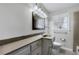 Bathroom with vanity, sink, toilet and a window view at 3063 Randolph Ne Rd, Atlanta, GA 30345