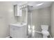 Bathroom featuring tiled shower, vanity, and updated lighting at 3063 Randolph Ne Rd, Atlanta, GA 30345