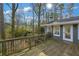 A wooden deck overlooking a lush, green landscape offers a peaceful outdoor space for relaxation at 3063 Randolph Ne Rd, Atlanta, GA 30345