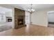 Dining area with brick fireplace, chandelier lighting and flow into the living area at 3063 Randolph Ne Rd, Atlanta, GA 30345