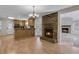 Inviting dining area with wood-burning fireplace open to kitchen and airy living room at 3063 Randolph Ne Rd, Atlanta, GA 30345