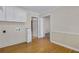 Spacious laundry room with wood floors and white accents at 3063 Randolph Ne Rd, Atlanta, GA 30345