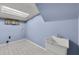 Laundry area featuring blue walls, utility sink, and tile flooring at 3063 Randolph Ne Rd, Atlanta, GA 30345