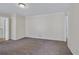 Living room features neutral paint, carpet, and white crown moulding at 3063 Randolph Ne Rd, Atlanta, GA 30345