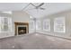 Bright and airy living room features vaulted ceiling, cozy fireplace, and large windows at 3063 Randolph Ne Rd, Atlanta, GA 30345