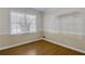 Room featuring hardwood floors and large window letting in natural light at 3063 Randolph Ne Rd, Atlanta, GA 30345