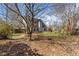 Large partially-wooded backyard with a mature canopy of trees at 3565 Mystic Dr, Buford, GA 30519