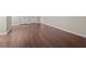 Spacious basement featuring beautiful hard wood flooring and neutral paint tones at 3565 Mystic Dr, Buford, GA 30519