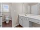 Bright bathroom featuring a single sink vanity, a toilet, and a shower and tub combo at 3565 Mystic Dr, Buford, GA 30519