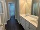 Bathroom featuring double vanity sinks with white countertops and natural lighting at 3565 Mystic Dr, Buford, GA 30519