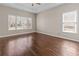 Bright bedroom with natural light, beautiful flooring, neutral paint and a tray ceiling at 3565 Mystic Dr, Buford, GA 30519