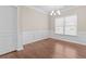 Bright dining room featuring a modern chandelier and large window at 3565 Mystic Dr, Buford, GA 30519