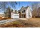 Charming two-story home featuring a brick and white exterior and well-maintained front yard at 3565 Mystic Dr, Buford, GA 30519