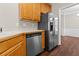 Stainless steel refrigerator and wood cabinets in the kitchen at 3565 Mystic Dr, Buford, GA 30519