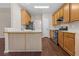 Bright kitchen featuring wood cabinets, stainless steel appliances, and breakfast bar at 3565 Mystic Dr, Buford, GA 30519
