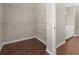 Walk-in closet with white wire shelving and wood look floors at 3565 Mystic Dr, Buford, GA 30519