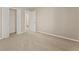 Neutral bedroom features a closet with white folding doors and a doorway to the hallway at 3670 Chestnut Meadows Dr, Douglasville, GA 30135