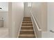 Carpeted staircase with white handrail at 3670 Chestnut Meadows Dr, Douglasville, GA 30135