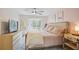 Bright bedroom with large bed, soft pink walls, and an outdoor view at 39 Saint Claire Ne Ln, Atlanta, GA 30324