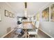 This dining area offers a farmhouse style dining table and chairs with modern lighting and decor at 39 Saint Claire Ne Ln, Atlanta, GA 30324