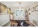 This dining area offers a farmhouse style dining table and chairs with modern lighting and decor at 39 Saint Claire Ne Ln, Atlanta, GA 30324