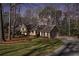 Beautifully landscaped home with mature trees and a welcoming entrance at 855 Colston Sw Rd, Marietta, GA 30064