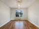 This bedroom features hardwood floors, white walls, a light fixture, and a window at 17 Cedars Glen Pl, Villa Rica, GA 30180